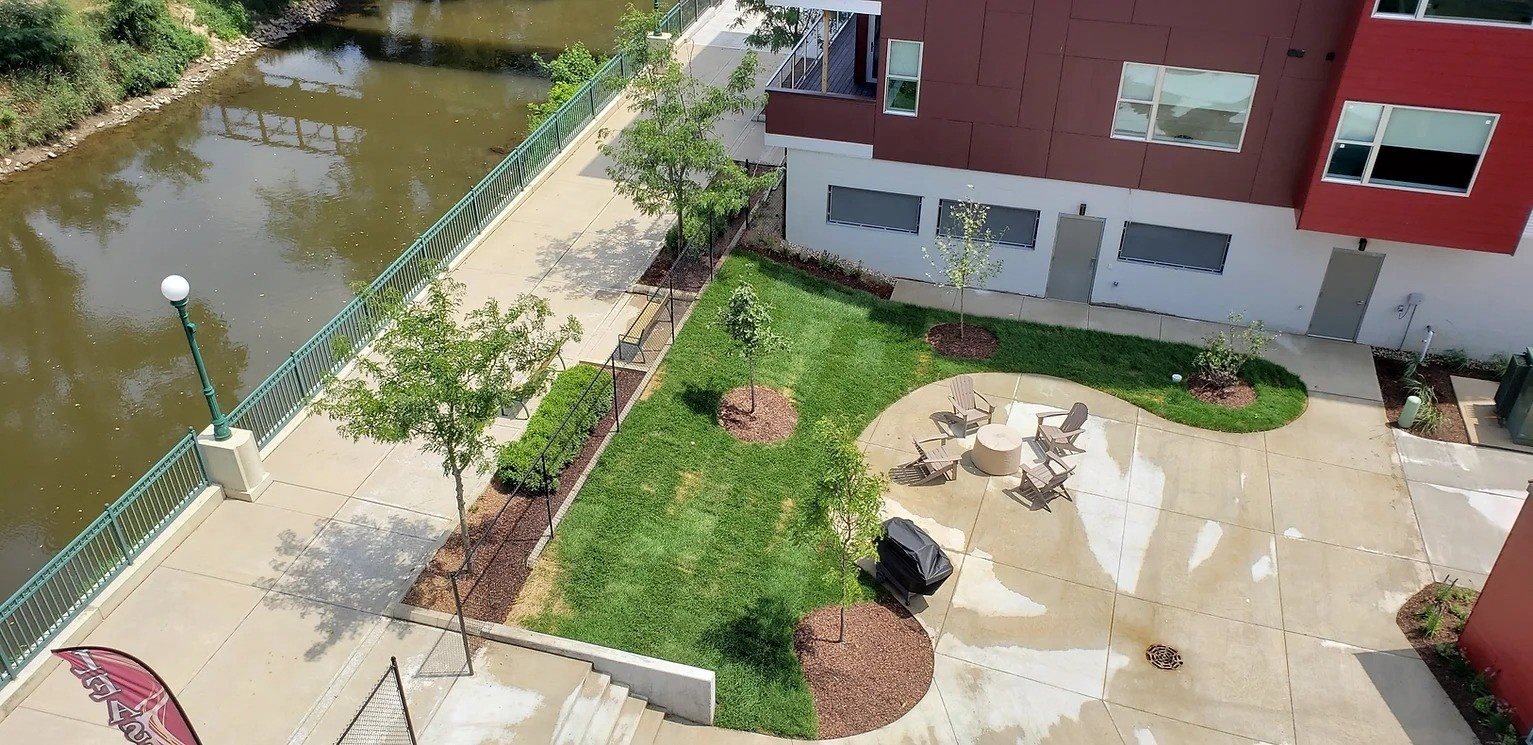 Aerial view from patio deck of river in the background at River Gate South apartments in Plymouth Indiana